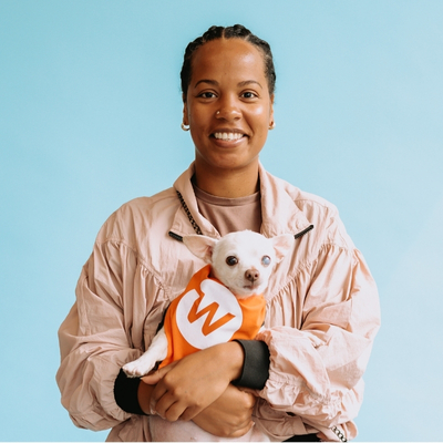 member with dog smiling