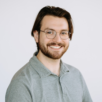 staff member smiling at camera
